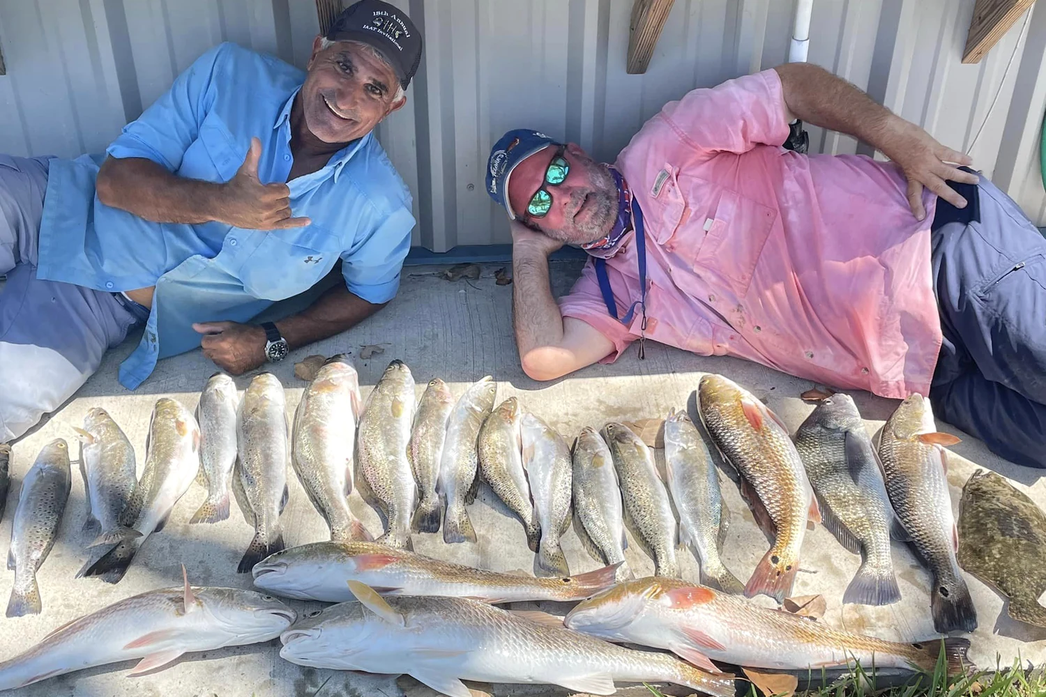 A group displaying a successful day’s catch