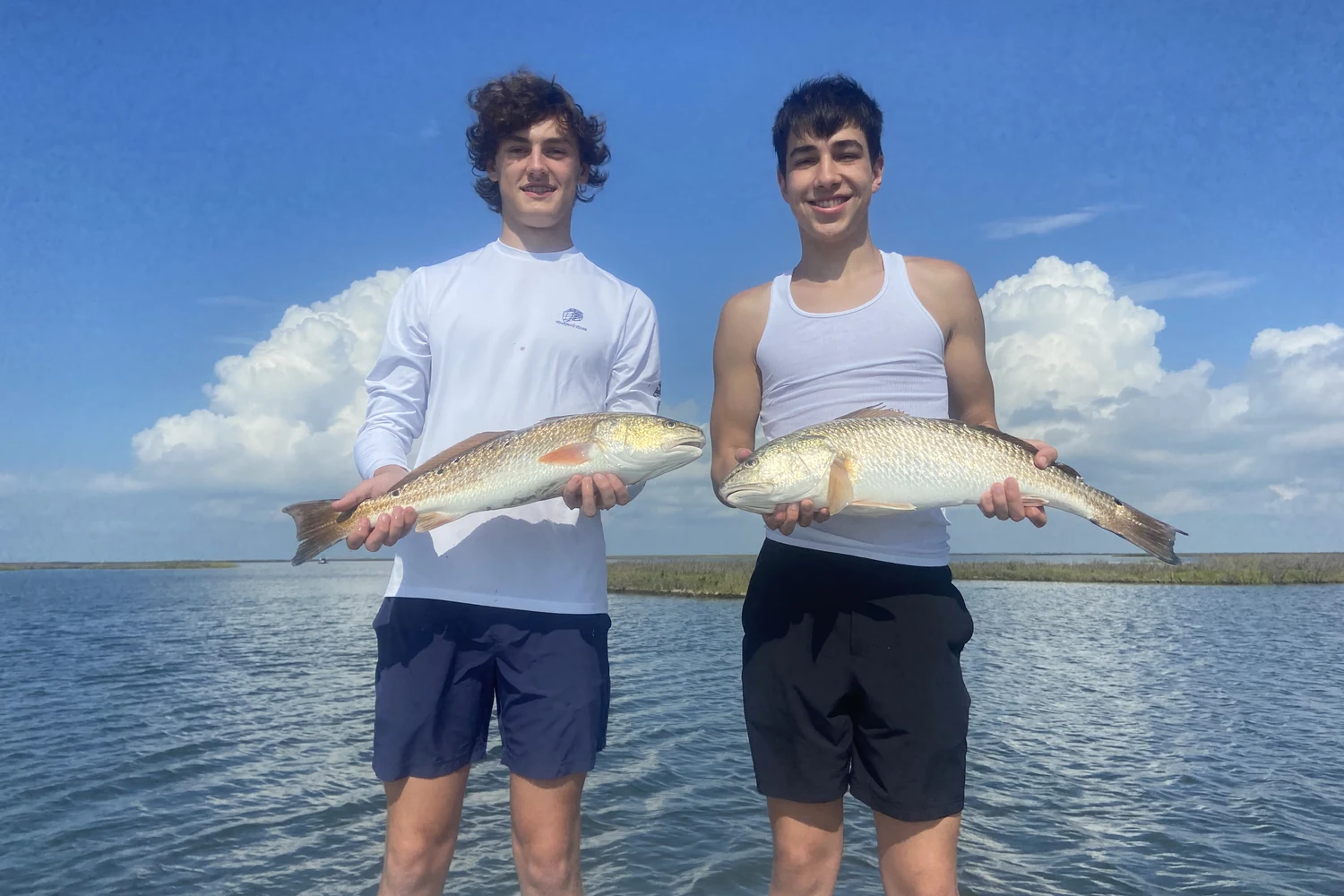 Young anglers enjoying a successful fishing day